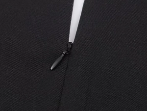 Detailed close-up of a hidden zipper on a black square neck sleeveless bodysuit