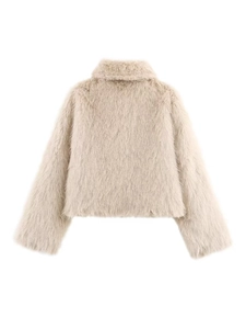 Close-up detail of beige faux fur jacket showing soft long plush texture and lapel