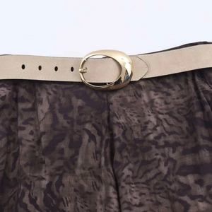 Women's summer fashion midi skirt with printed pattern and beige belt with gold oval buckle