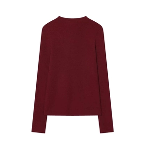 Detail of burgundy ribbed knit sweater with crew neck and fitted long sleeves finish