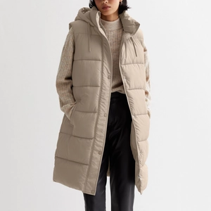 Women's long quilted hooded vest in beige with windproof zipper and drawstring detail