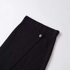 Dark grey knitted skirt with a stylish asymmetric hem and single button waist detail