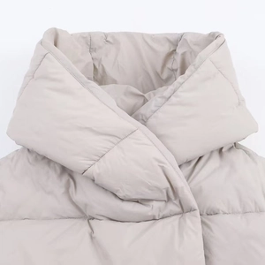 Winter padded hooded jacket for women in light beige featuring a quilted texture design