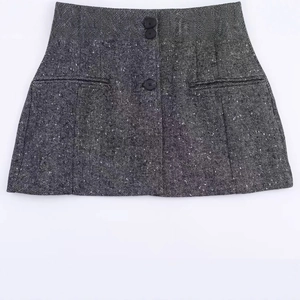 Deep grey herringbone wool mini skirt with three buttons and decorative pockets
