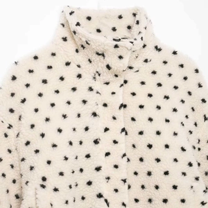 Vintage polka dot fleece jacket with a high collar in creamy white and black star pattern