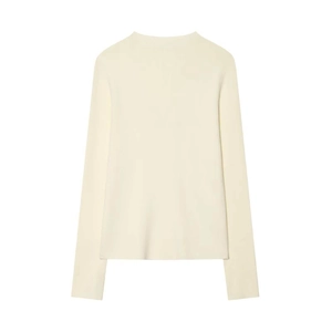 Detail view of the ribbed cuffs and hem on this cream long-sleeve knit sweater