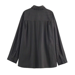 Rear view of oversized black and grey plaid shirt featuring high-quality cotton texture