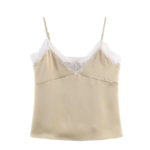 Close-up of champagne satin camisole featuring delicate white eyelash lace V-neckline