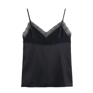Close-up of black satin camisole featuring delicate lace trim and thin shoulder straps
