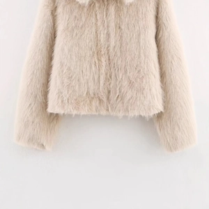 Women's faux fur jacket in ivory white with smooth fluffy texture for winter fashion