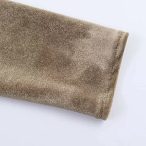 Detailed close-up of brown velvet long sleeve cuff with high-quality stitching and texture