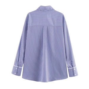 Back view of loose blue and white striped long-sleeve shirt with back pleat and cuffs