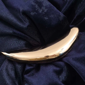 Elegant gold crescent metal buckle on premium navy blue velvet long maxi dress