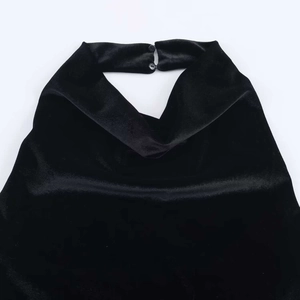 Elegant black velvet halter dress featuring back neck button closure and draped neckline
