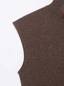 Close-up of the fine knit texture and high neckline of the sleeveless brown summer dress