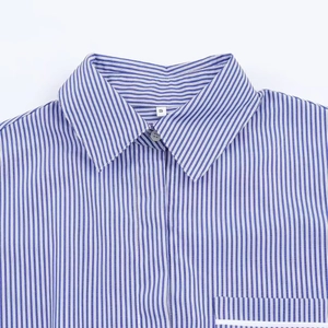 Detail of blue and white vertical striped shirt collar with size S tag and button