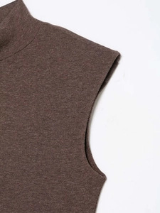 Detailed close-up of dark brown mock neck sleeveless knit top with fine texture