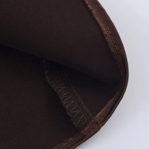 Macro view of high-density dark brown knit fabric with fine stitching details