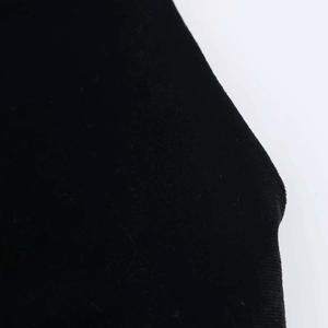 Close-up of elegant black velvet fabric showing fine texture and premium stretch material