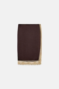 Detail of elegant dark brown satin fabric featuring a delicate beige lace trim finish