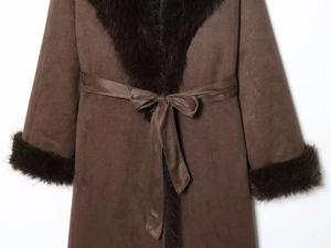 Close-up of brown suede long coat with faux fur collar, fur cuffs and a waist tie bow