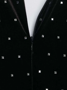 Detail of black velvet midi skirt with silver rhinestones and a hidden zipper closure