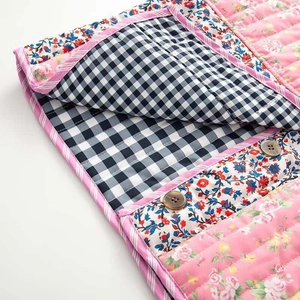 Quilted floral patchwork jacket with vintage pink roses and contrast stripe piping detail