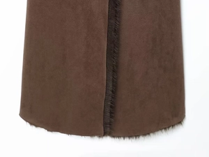 Detailed view of the dark brown suede fabric with premium thick faux fur trim edges