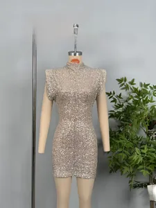 Detail of champagne pink sequined mini dress with high neck and slim fit design
