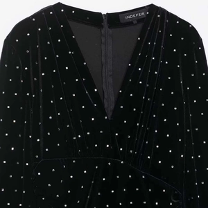Elegant black velvet midi dress with silver beaded studs and deep V-neck design