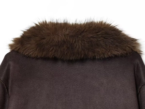 Detailed close-up of dark brown jacket collar with thick faux fur lining and suede texture