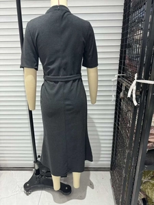 Rear view of slim fit dark gray short sleeve midi dress with matching belt and stand collar