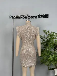 Detail view showing the sequin fabric and high-neck back of a champagne bodycon dress