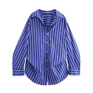 Detail of blue and white striped long sleeve shirt with front pocket and buttons