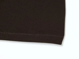 Close-up of the professional stitching and hem detail on the black sleeveless maxi dress