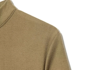 Detailed close-up of khaki short-sleeve dress neckline and shoulder seam textures