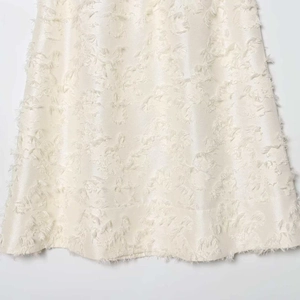 Elegant off-white jacquard midi dress featuring 3D floral fringe texture and silky finish