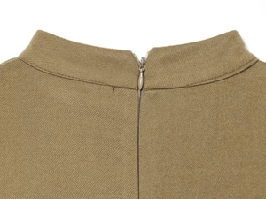 Detail view of the stand collar and invisible zipper on a khaki short sleeve dress