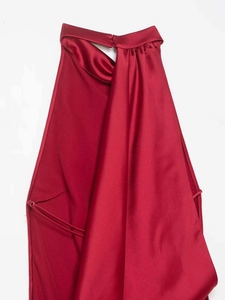 Detailed view of the dark red satin halter neck dress with glossy fabric and neck clasp