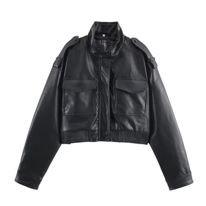 Detail of vintage black faux leather cropped jacket with utility pockets and shoulder straps