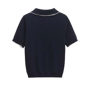 Detail view of navy short-sleeve knit polo shirt with white scalloped lace trim on back