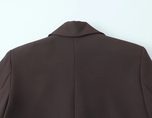 Detailed back view of dark brown blazer featuring premium stitching and structured collar