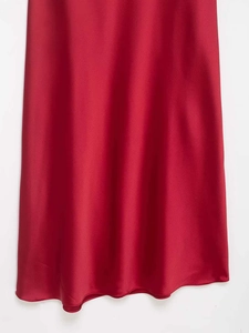 Close-up of elegant red satin fabric with smooth texture and glossy silk finish