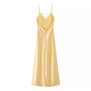 Detailed back view of light yellow satin midi dress with criss-cross spaghetti straps