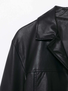 Close-up of black PU leather jacket lapel featuring fine texture and double stitching