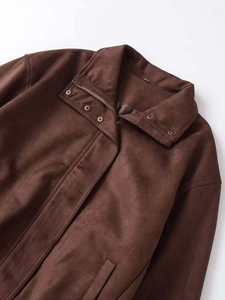 Detail of vintage chocolate faux suede jacket featuring stand collar and metal zipper