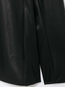 Macro shot of high-quality black faux leather texture and clean vertical stitching
