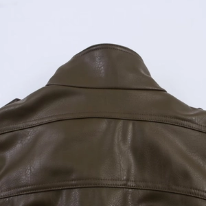 Close-up of dark brown faux leather jacket collar with premium double stitching details
