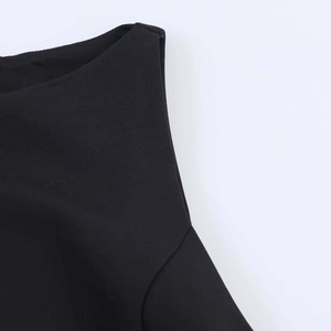 Macro detail of the elegant black bow V-neck sleeveless dress with fine matte texture