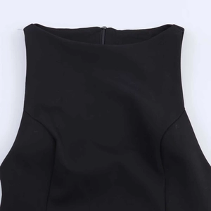 Detail of elegant black sleeveless dress featuring bateau neck and invisible back zipper